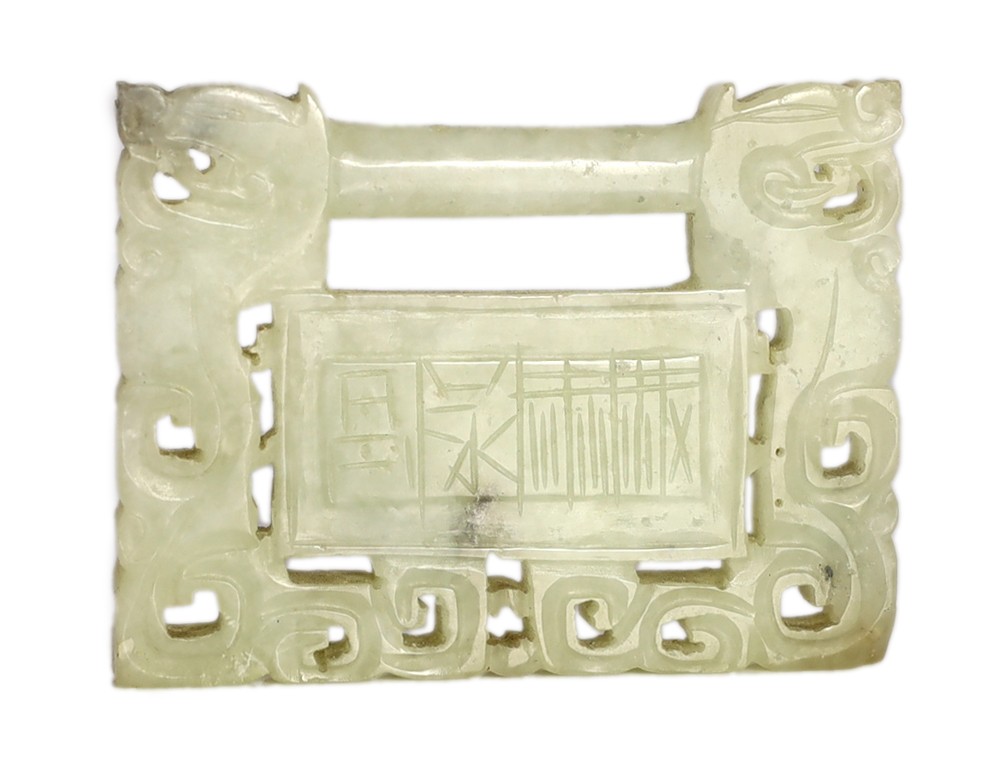 A Chinese speckled white jade ‘lock’ pendant plaque, 19th/20th century, 7.6cm x 5.8cm, wood stand